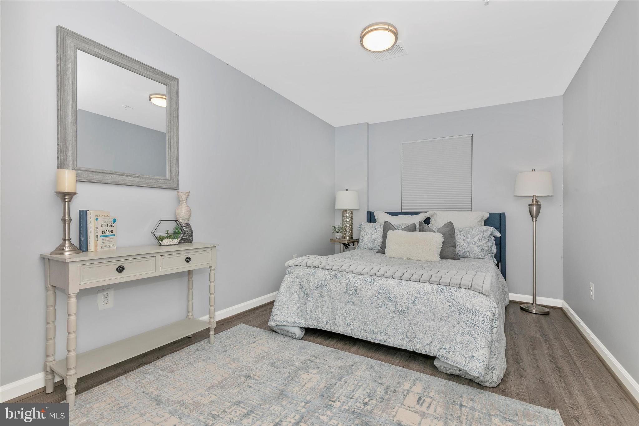 7821 Wormans Mill Road Frederick, MD 21701 - Photo 8 of 44 a spacious bedroom with a bed and a dresser