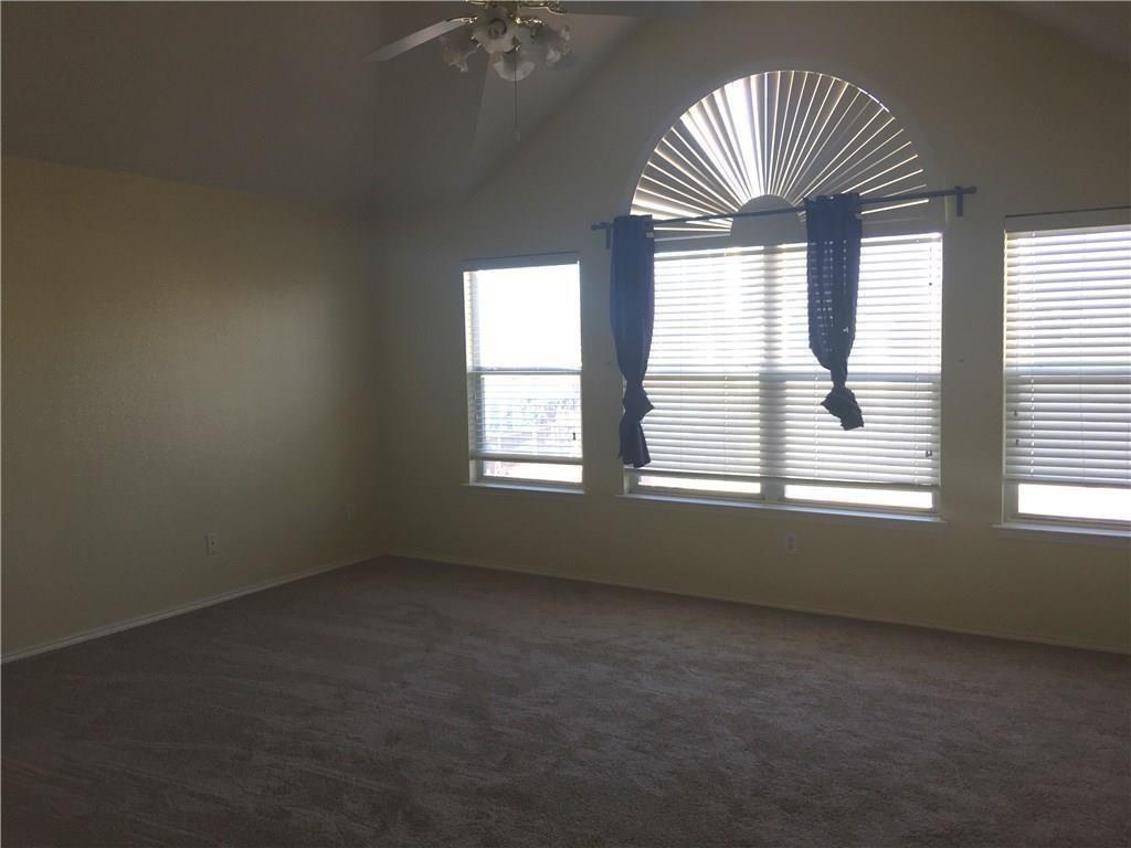 4433 Riptide Lane Plano, TX 75024 - Photo 11 of 12 Room featuring a vaulted ceiling, ceiling fan, and carpeted flooring