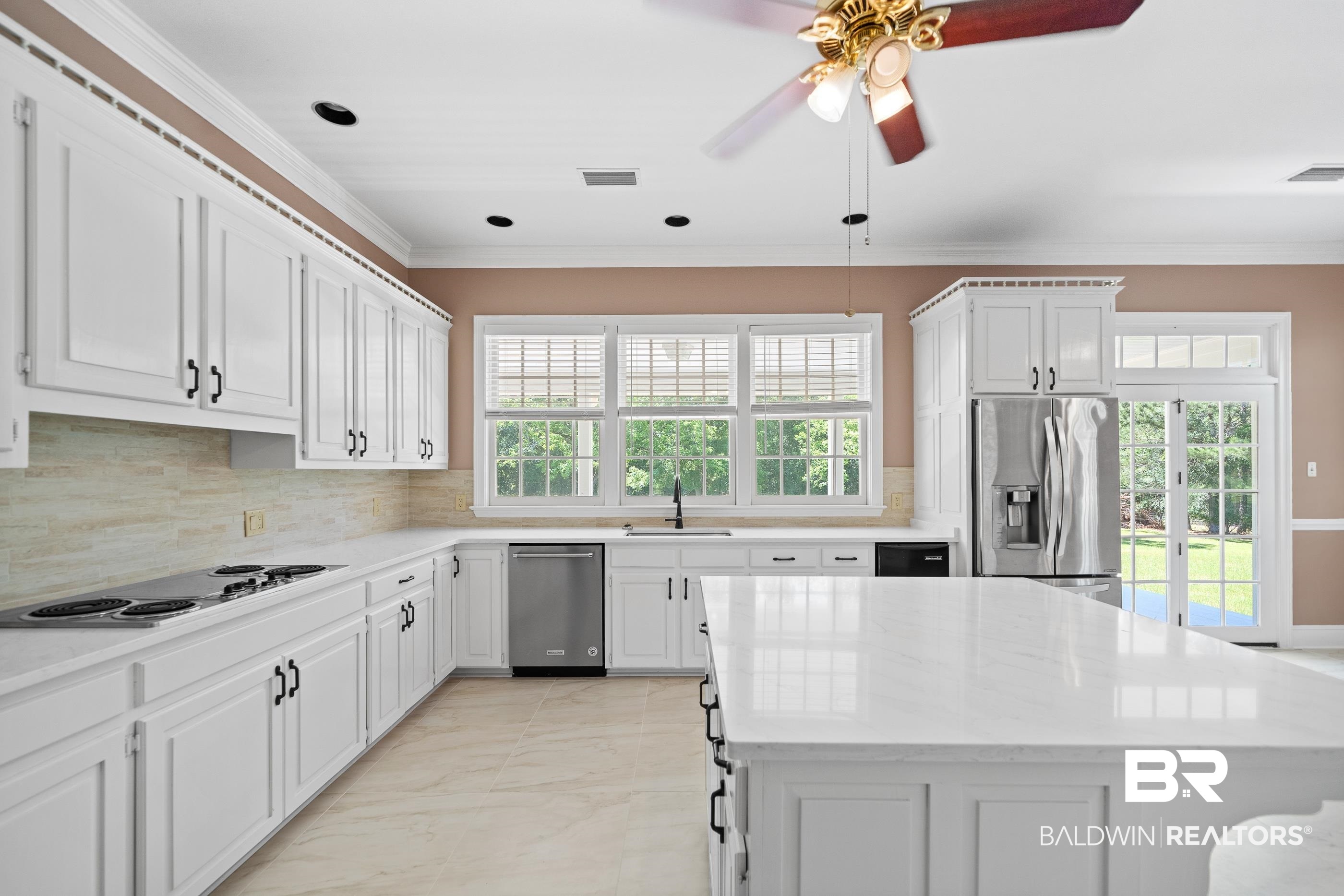 17741 County Road 55 Silverhill, AL 36576 - Photo 16 of 49 Painted Cabinets and Tiled Backsplash