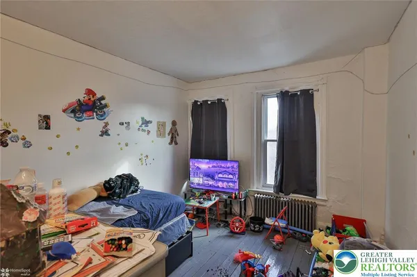 a room with furniture and gym equipment