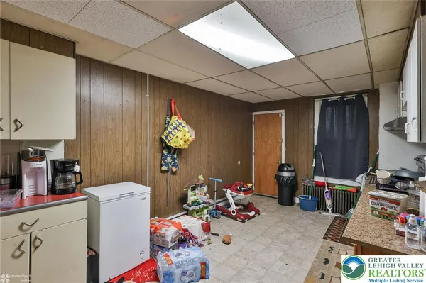 a kitchen with a stove a refrigerator and cabinets