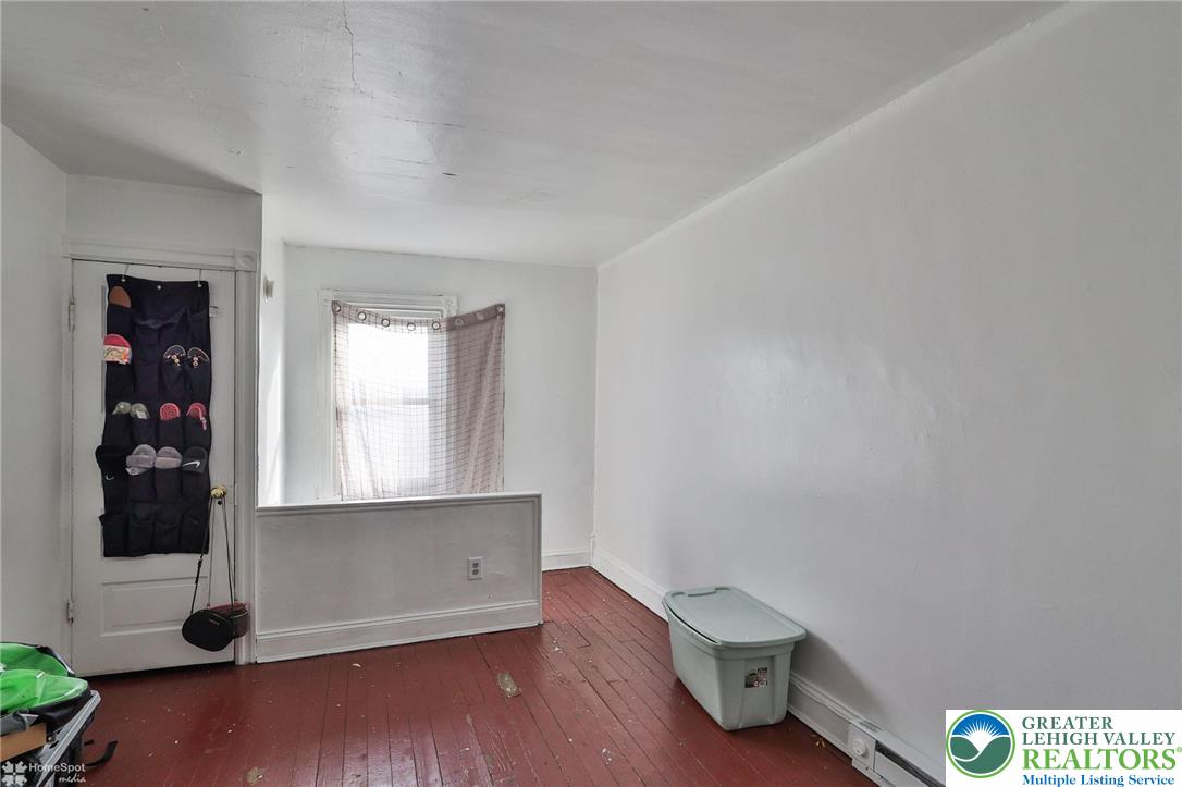 705 North Front Street Allentown, PA 18102 - Photo 25 of 44 an empty room with wooden floor and closet