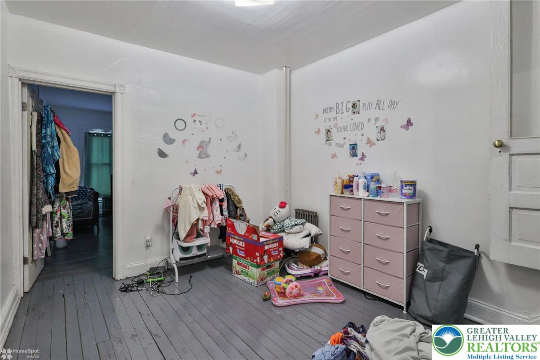 705 North Front Street Allentown, PA 18102 - Photo 27 of 44 a room with furniture and wooden floor