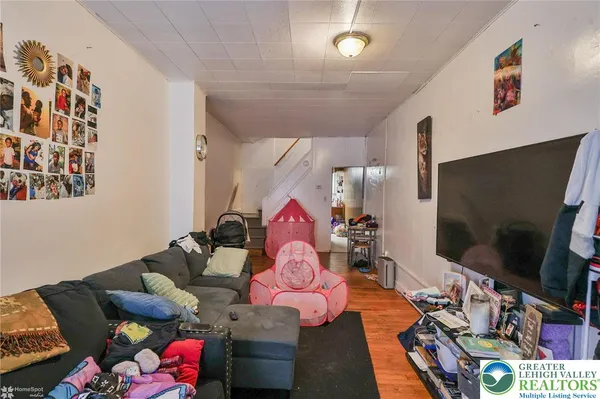a living room with furniture and a flat screen tv