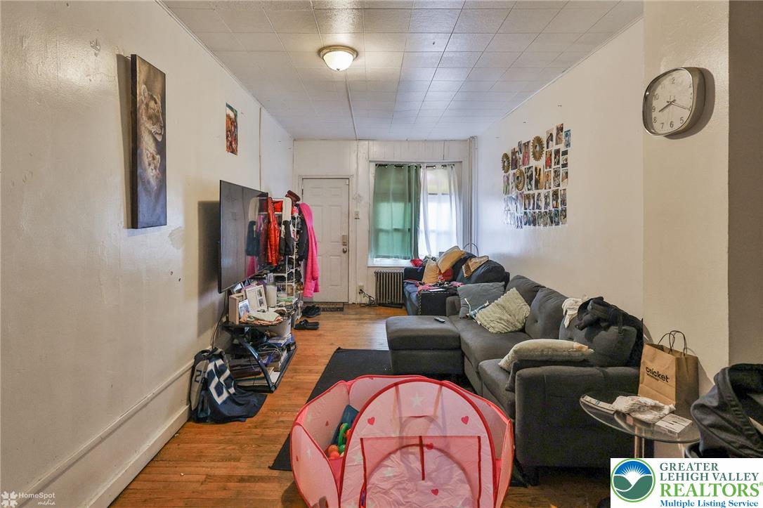 705 North Front Street Allentown, PA 18102 - Photo 10 of 44 a living room with furniture a rug and a window