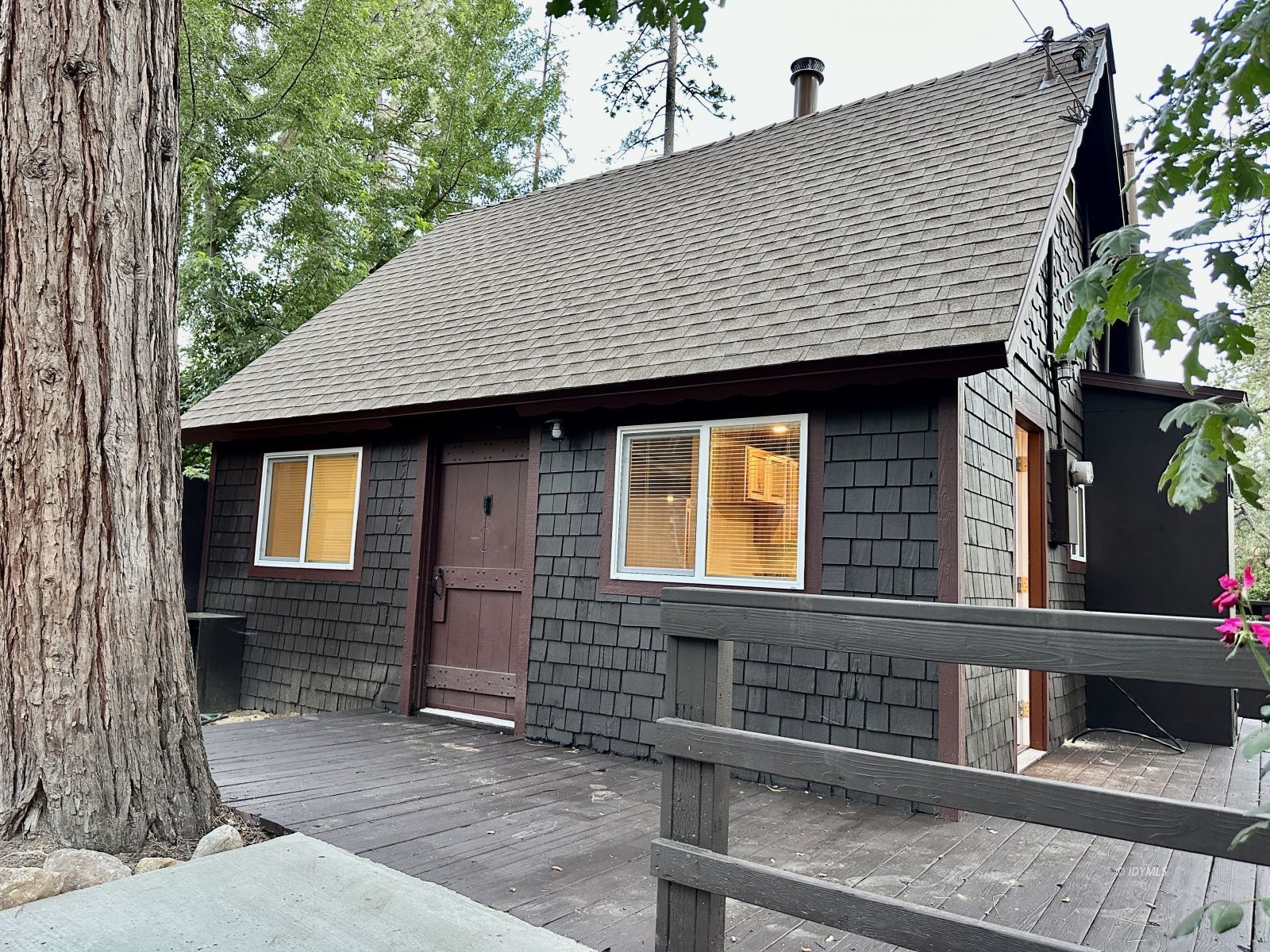 25165 Cedar, Unit A Idyllwild, CA 92549 - Photo 1 of 26 a front view of a house having yard