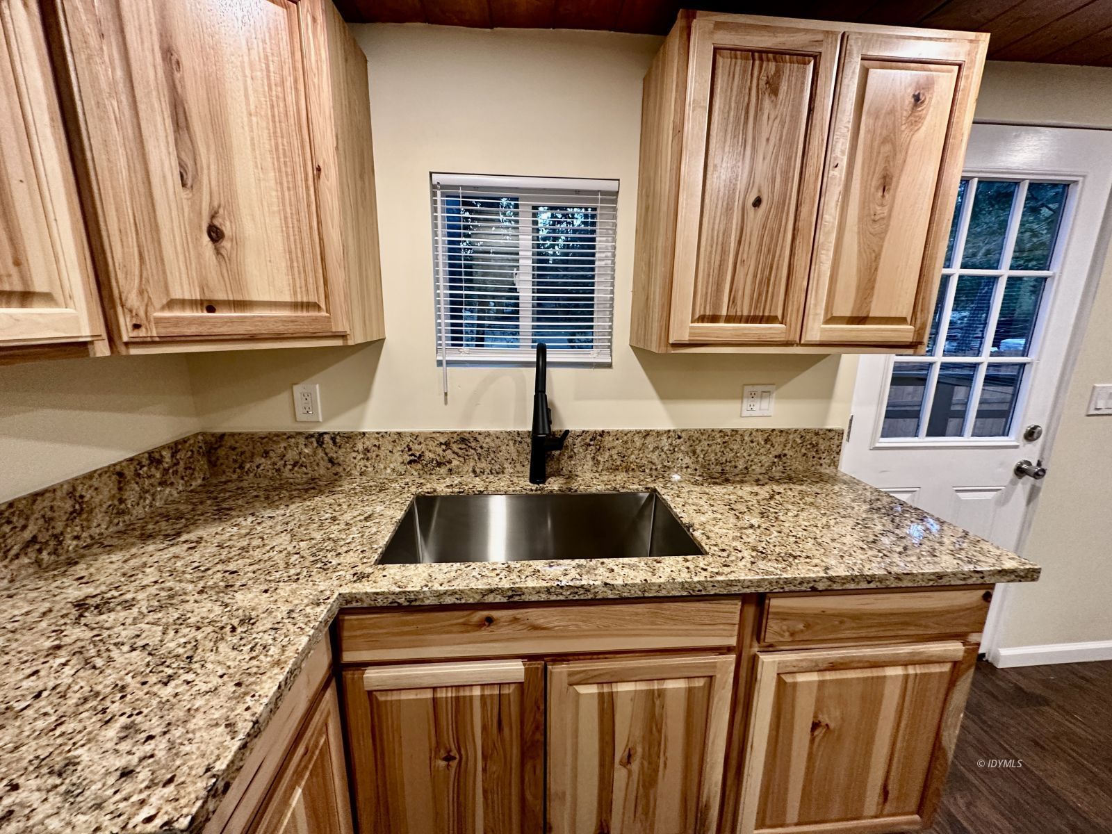 25165 Cedar, Unit A Idyllwild, CA 92549 - Photo 11 of 26 a kitchen with granite countertop a sink and a window