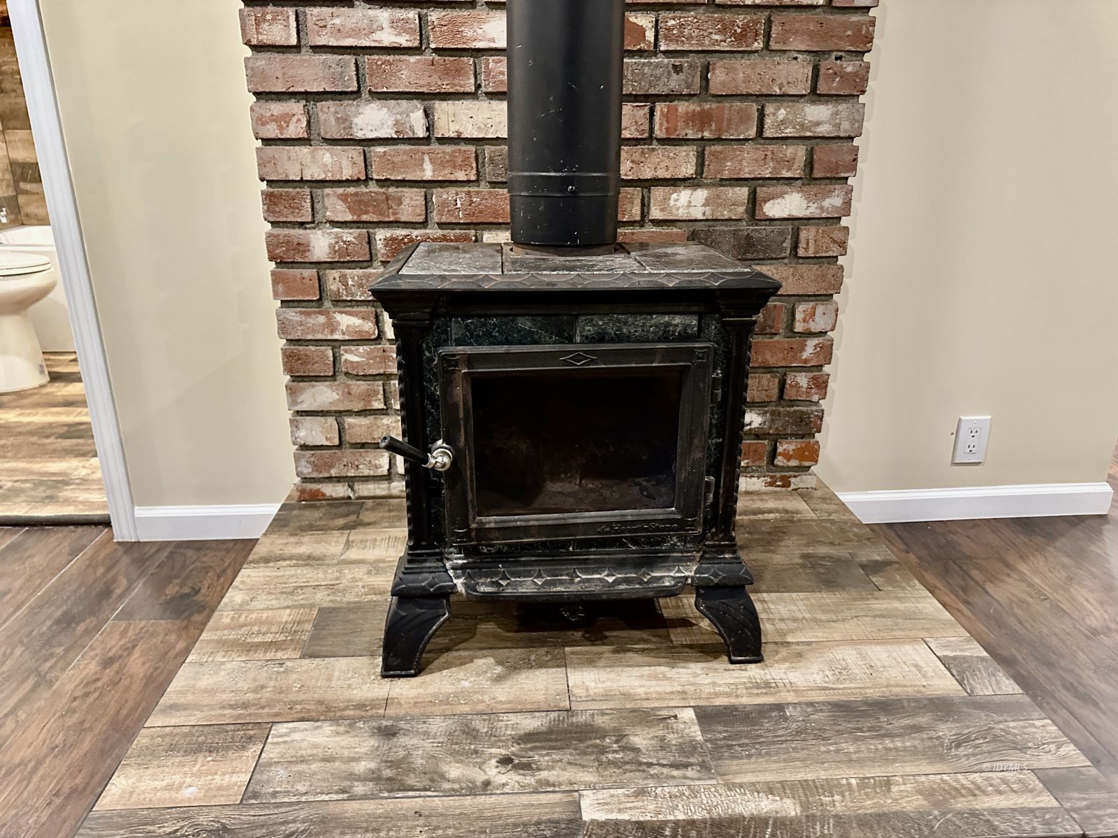 25165 Cedar, Unit A Idyllwild, CA 92549 - Photo 15 of 26 a view of fireplace and wooden floor
