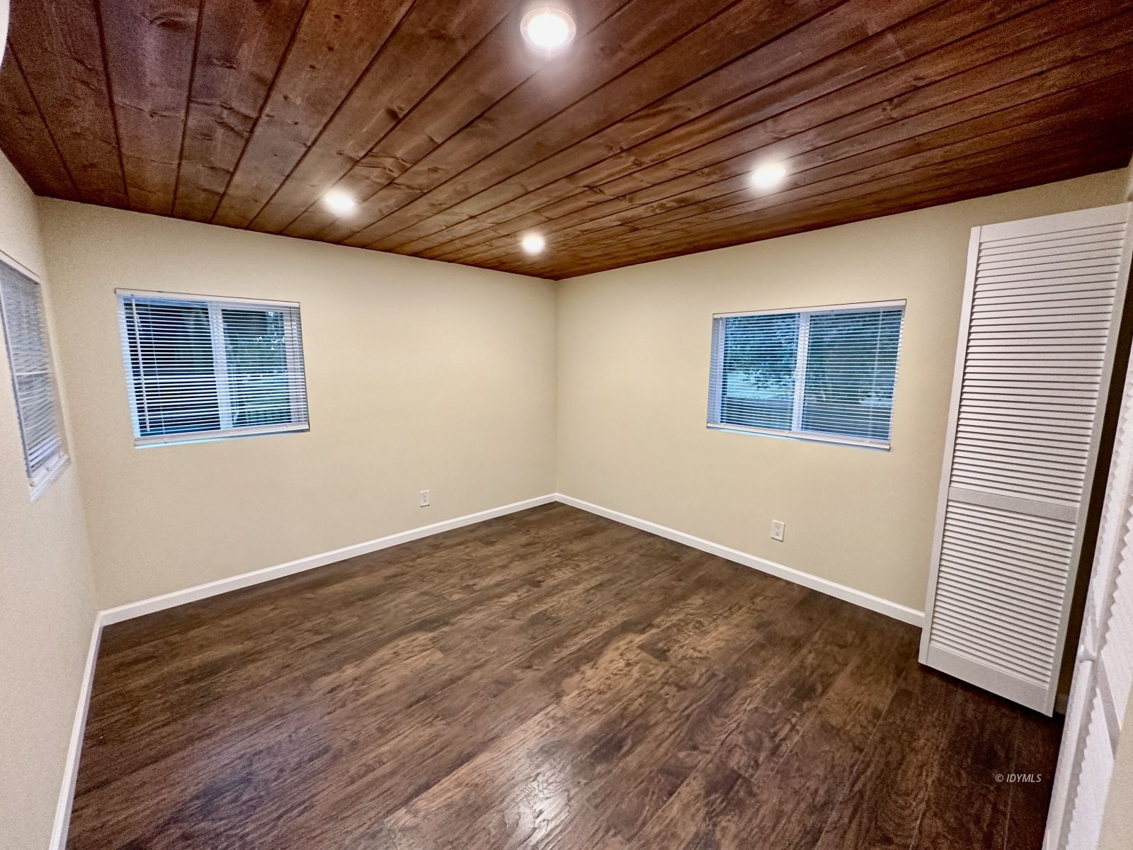 25165 Cedar, Unit A Idyllwild, CA 92549 - Photo 18 of 26 a view of empty room with wooden floor