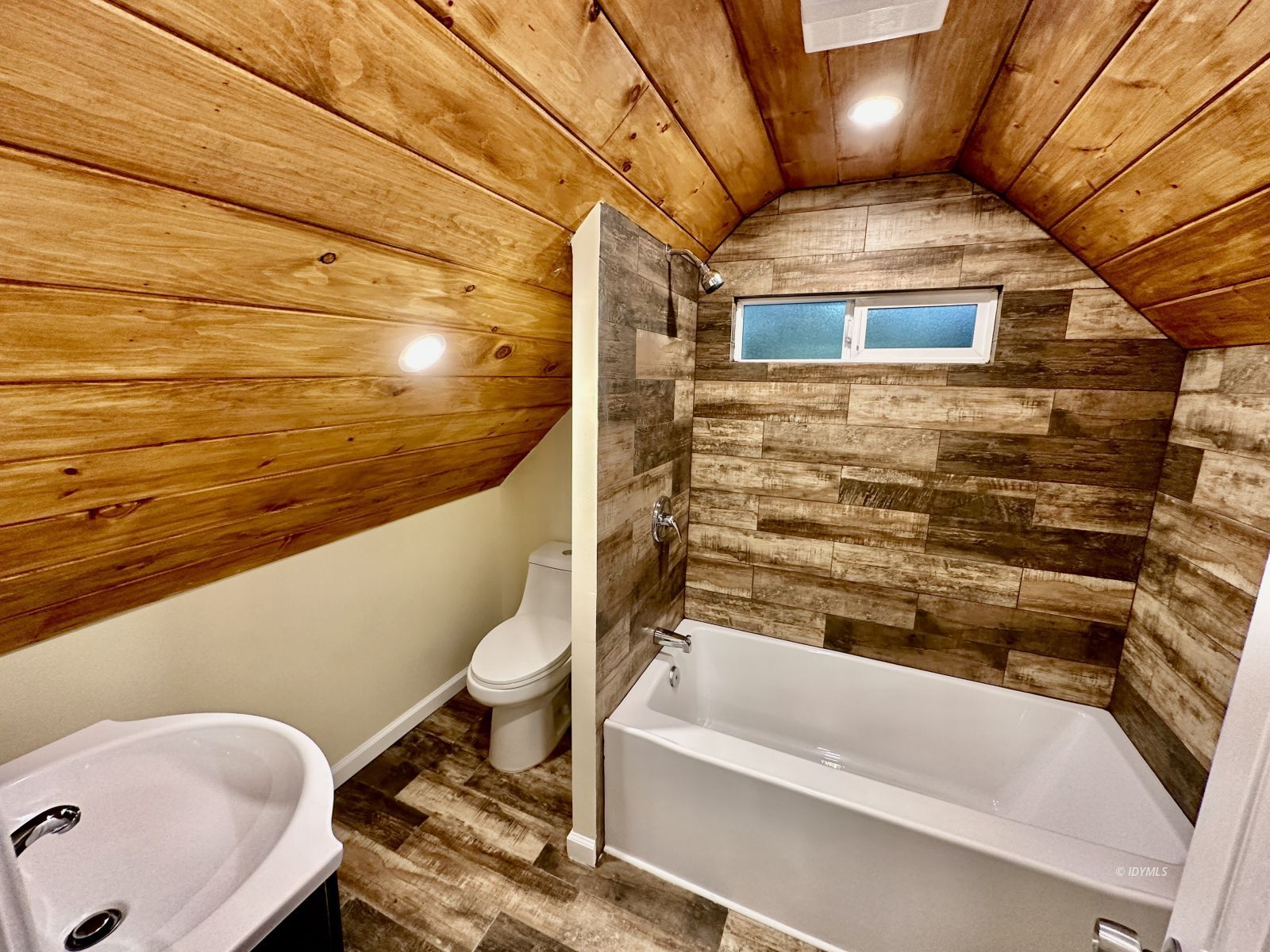 25165 Cedar, Unit A Idyllwild, CA 92549 - Photo 25 of 26 a bathroom with a bathtub and shower