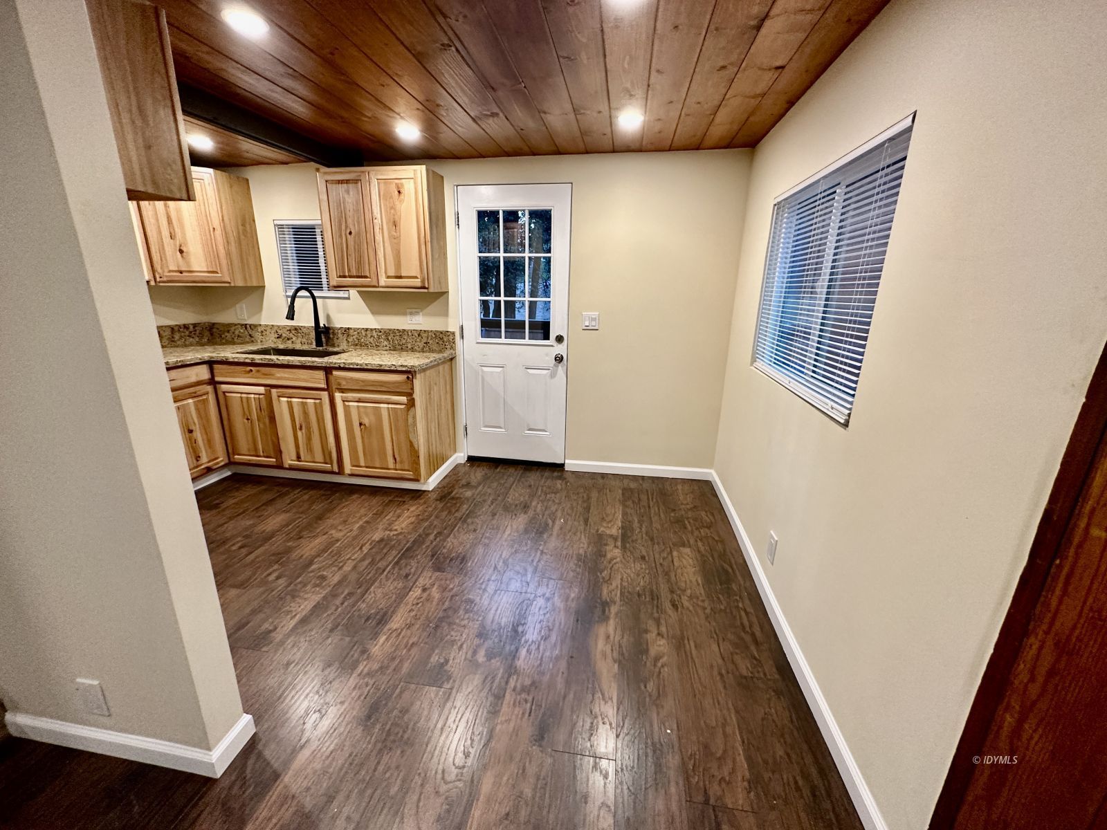 25165 Cedar, Unit A Idyllwild, CA 92549 - Photo 9 of 26 a kitchen with a sink and wooden floor