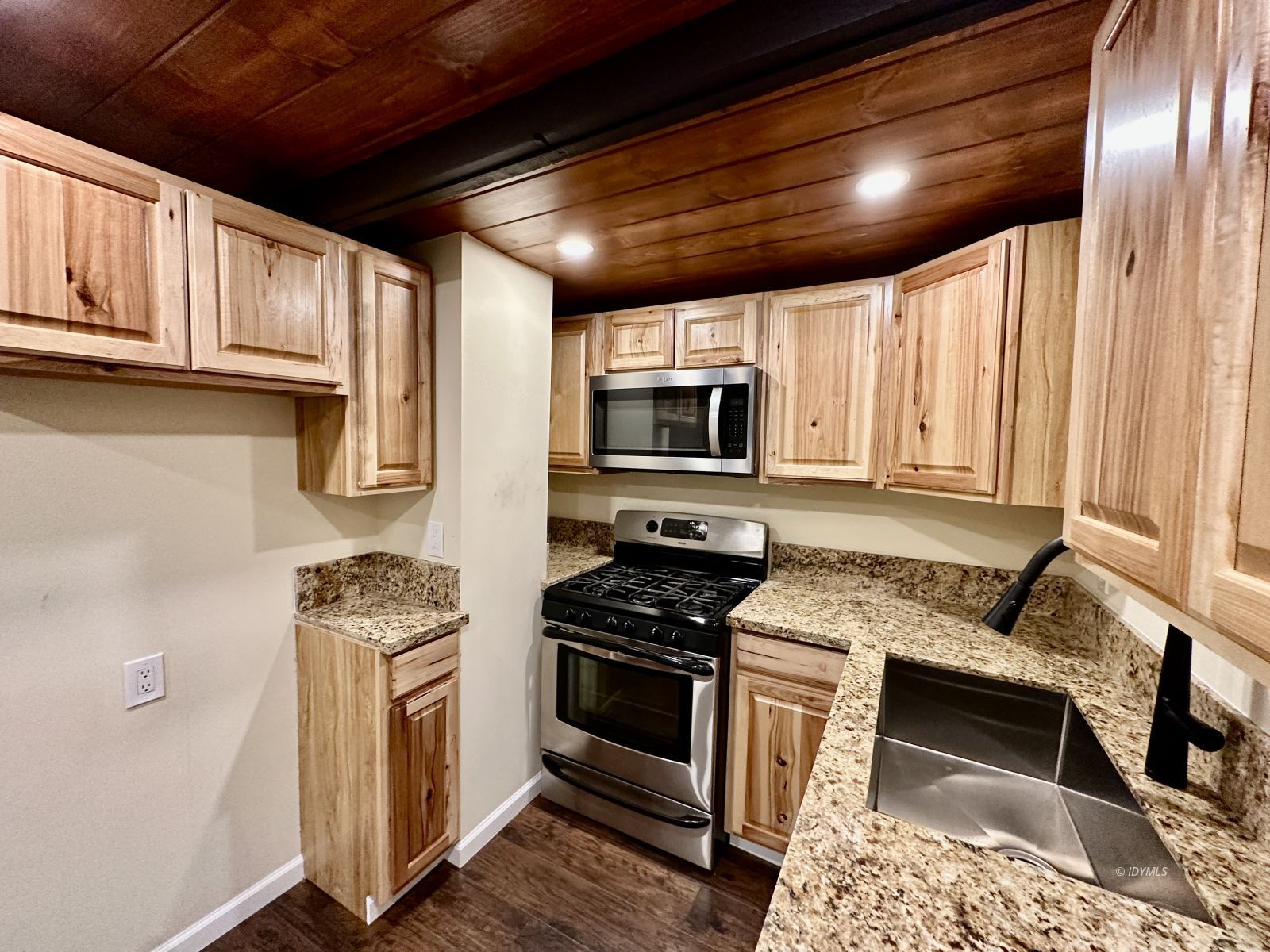 25165 Cedar, Unit A Idyllwild, CA 92549 - Photo 10 of 26 a kitchen with stainless steel appliances granite countertop a stove sink and microwave