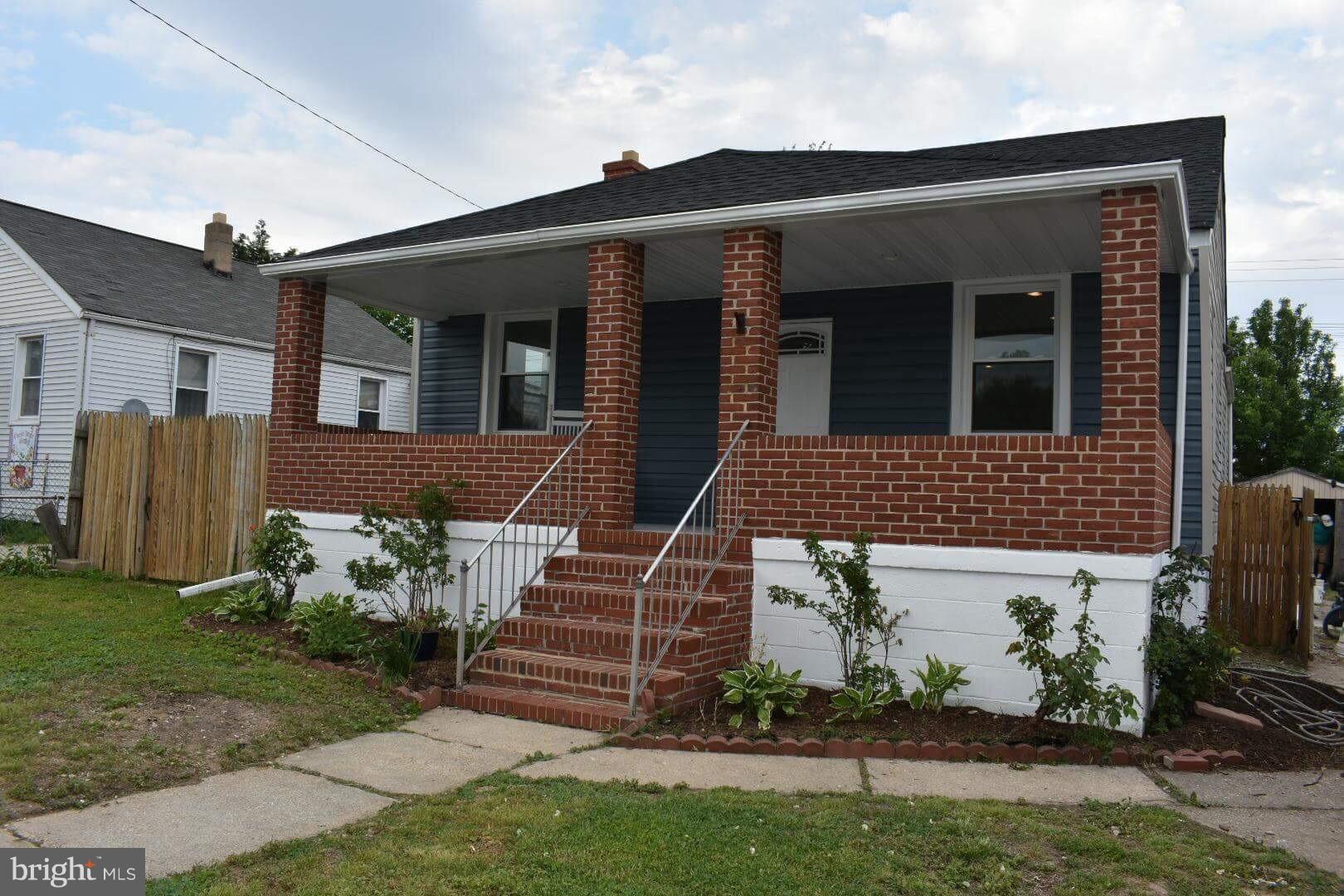 238 Pinewood Road Baltimore, MD 21222 - Photo 1 of 22 a front view of a house with garden