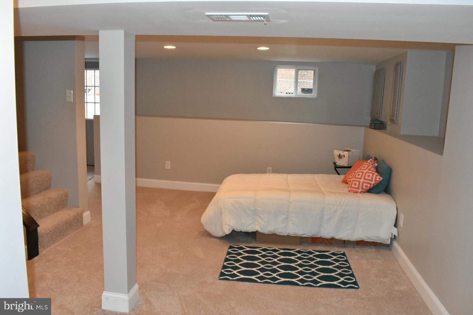 238 Pinewood Road Baltimore, MD 21222 - Photo 13 of 22 a bedroom with a bed and a window
