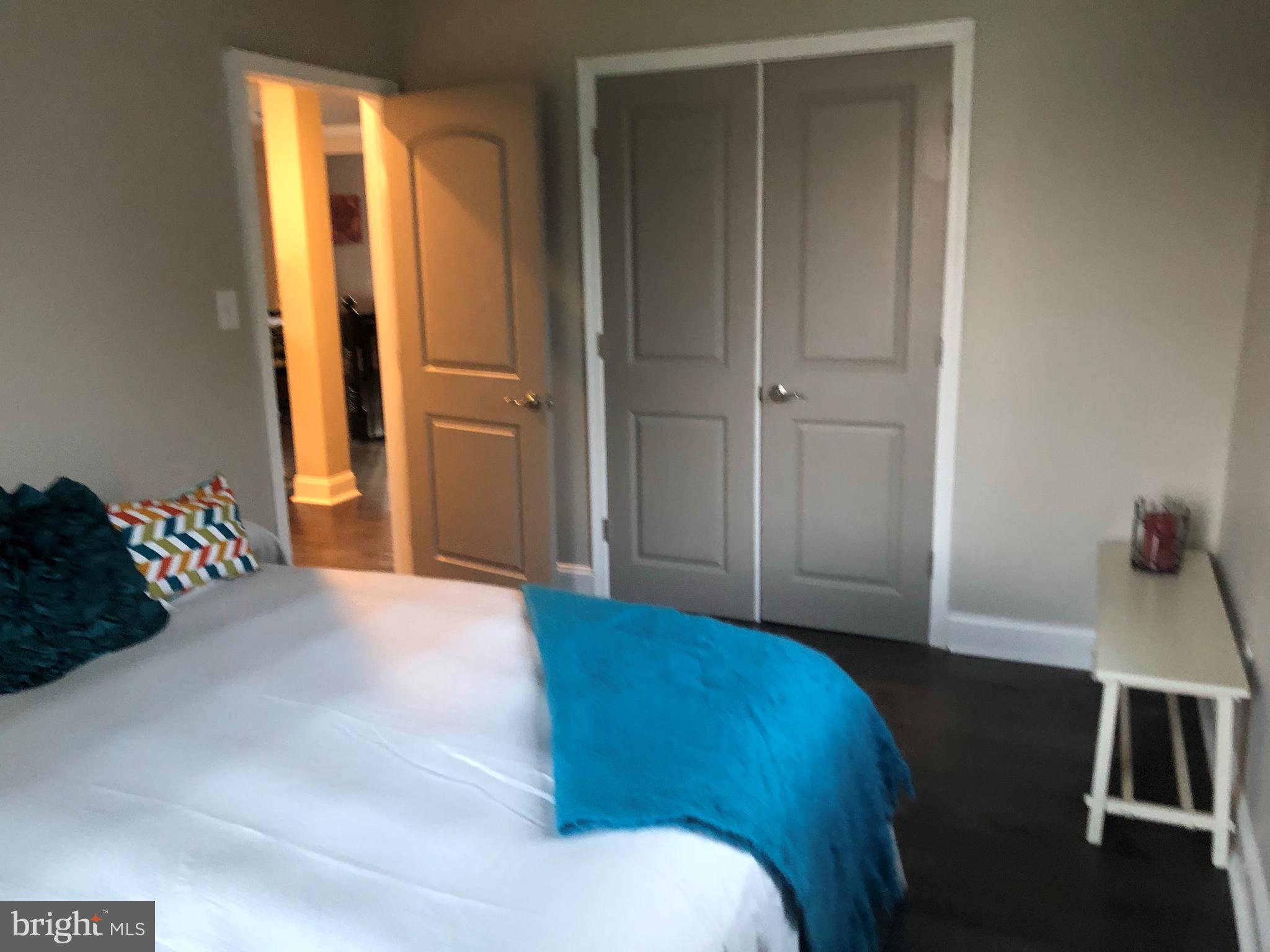 238 Pinewood Road Baltimore, MD 21222 - Photo 20 of 22 a bedroom with a bed and a desk
