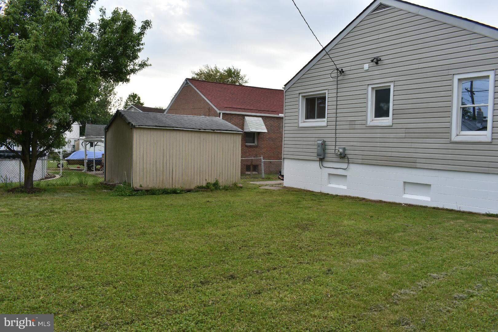 238 Pinewood Road Baltimore, MD 21222 - Photo 22 of 22 a view of a backyard with a garden