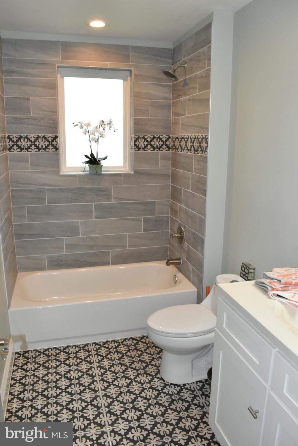 238 Pinewood Road Baltimore, MD 21222 - Photo 9 of 22 a bathroom with a bathtub and a shower