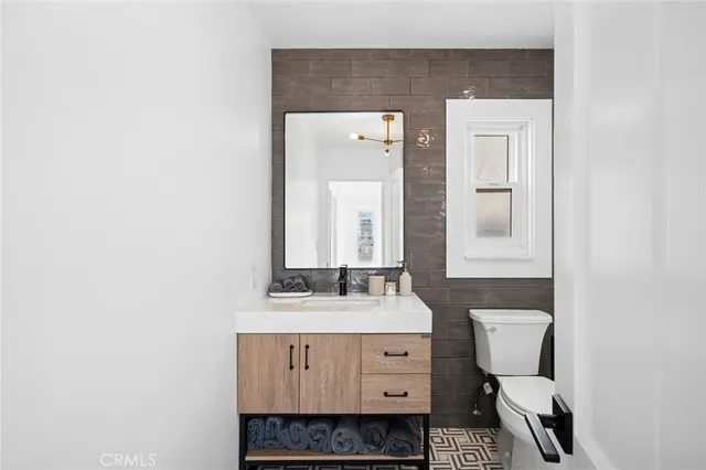 a bedroom with a bed and a lamp