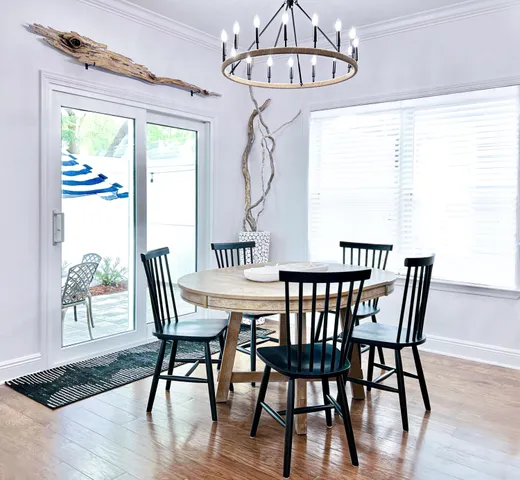 a view of a dining room with furniture window and wooden floor