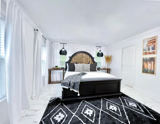 a bed room with a bed and a window