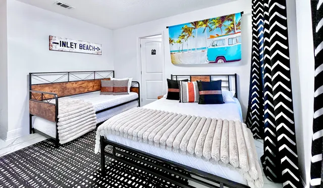 a bedroom with a bed and a window