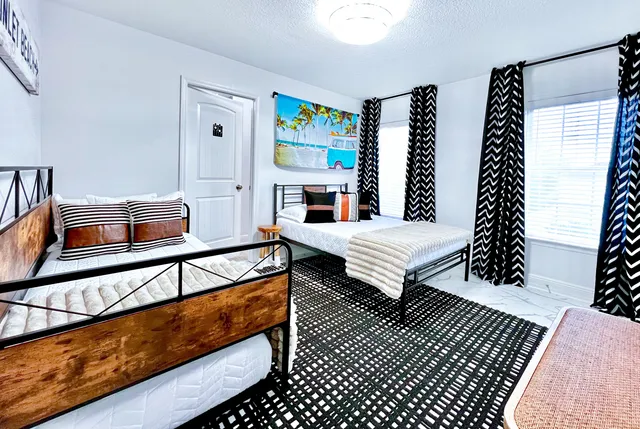 a bedroom with furniture and a wooden floor