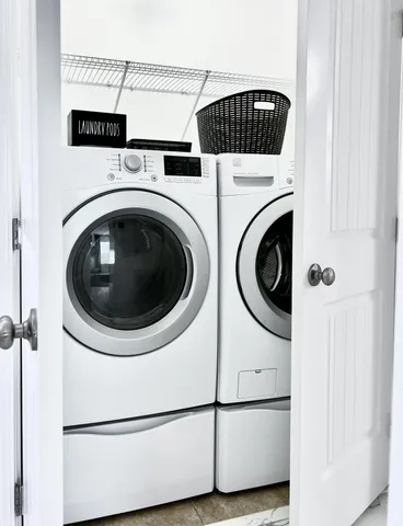 a utility room with dryer and washer