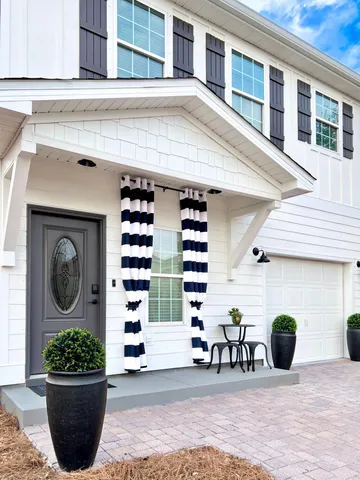 a view of a house with outdoor space and porch