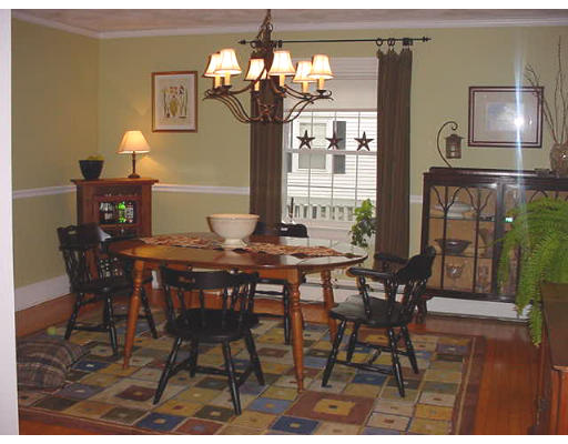 3 Hidden Road Andover, MA 01810 - Photo 3 of 13 a view of a dining room with furniture and chandelier