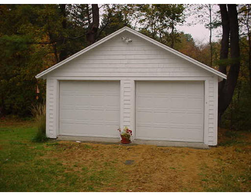 3 Hidden Road Andover, MA 01810 - Photo 5 of 13 a small white house with a outdoor space