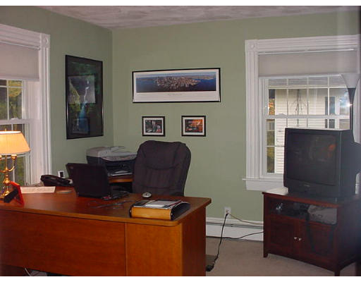 3 Hidden Road Andover, MA 01810 - Photo 8 of 13 a living room with furniture and a flat screen tv
