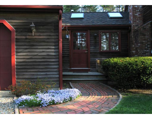 609 Marys Pond Road Rochester, MA 02770 - Photo 17 of 18 a front view of a house with a yard