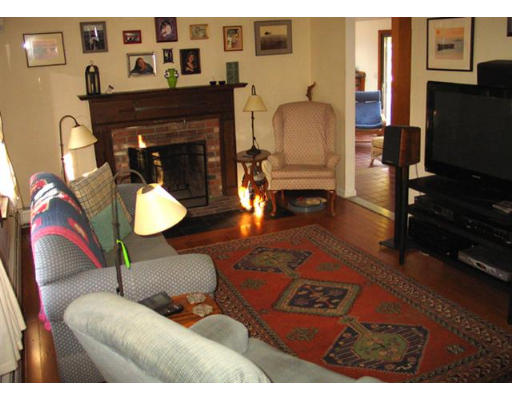 609 Marys Pond Road Rochester, MA 02770 - Photo 9 of 18 a living room with furniture and a fireplace
