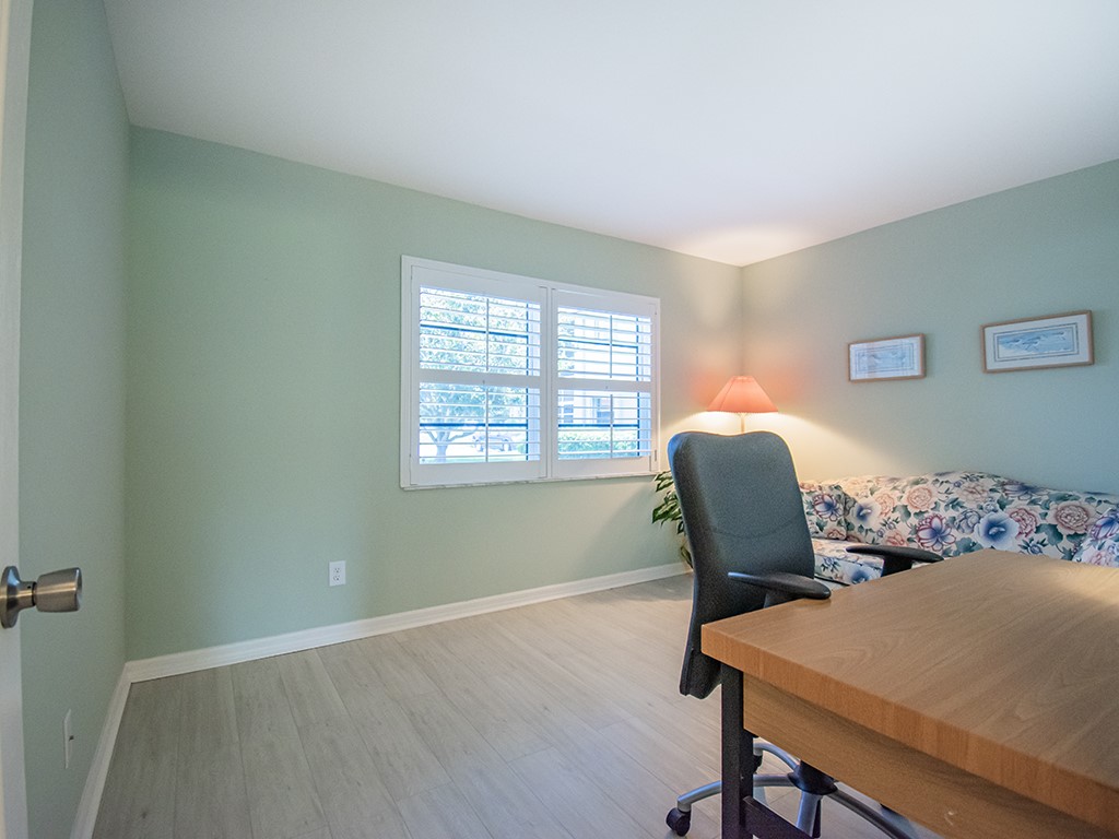 Undisclosed Address Vero Beach, FL 32962 - Photo 13 of 31 a view of a workspace with furniture and a window
