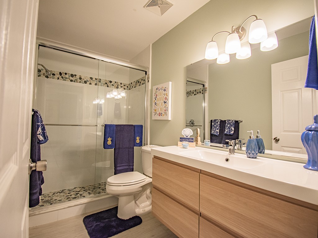 Undisclosed Address Vero Beach, FL 32962 - Photo 15 of 31 a bathroom with a sink a toilet and a mirror