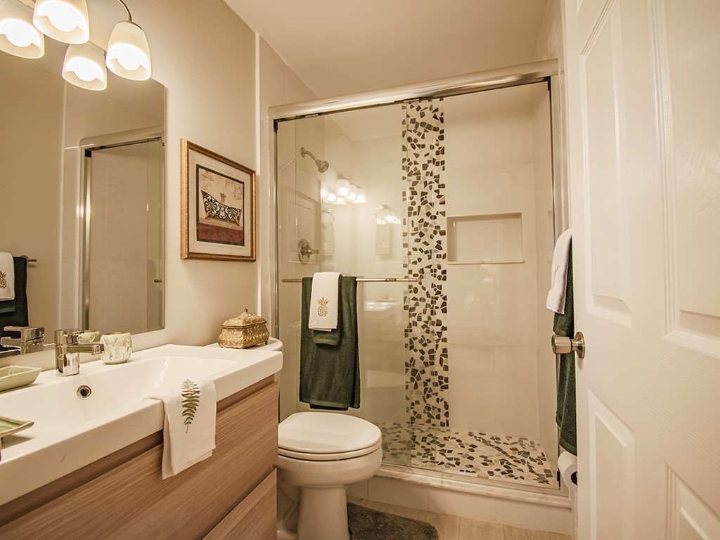 Undisclosed Address Vero Beach, FL 32962 - Photo 20 of 31 a bathroom with a sink toilet and shower