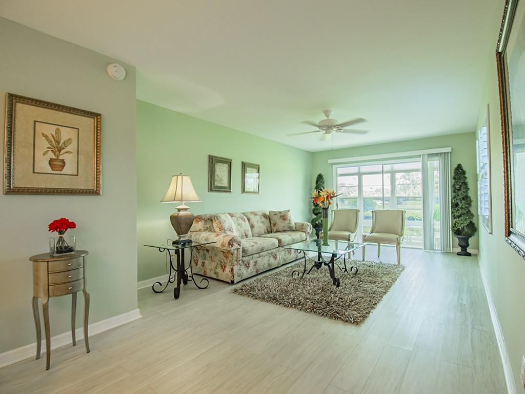 Undisclosed Address Vero Beach, FL 32962 - Photo 9 of 31 a living room with furniture and a wooden floor