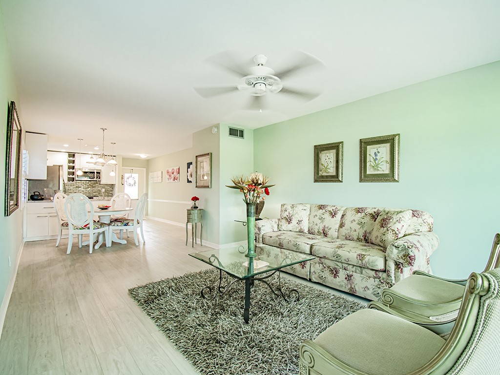 Undisclosed Address Vero Beach, FL 32962 - Photo 10 of 31 a living room with furniture and a chandelier