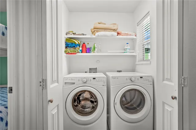 a utility room with dryer and washer