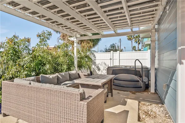 a view of balcony with couch and chairs