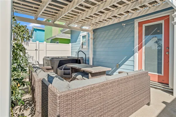 a view of a balcony with chair and wooden floor