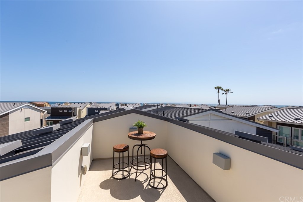 5505 River Avenue Newport Beach, CA 92663 - Photo 25 of 40 a view of a terrace with chairs and stove