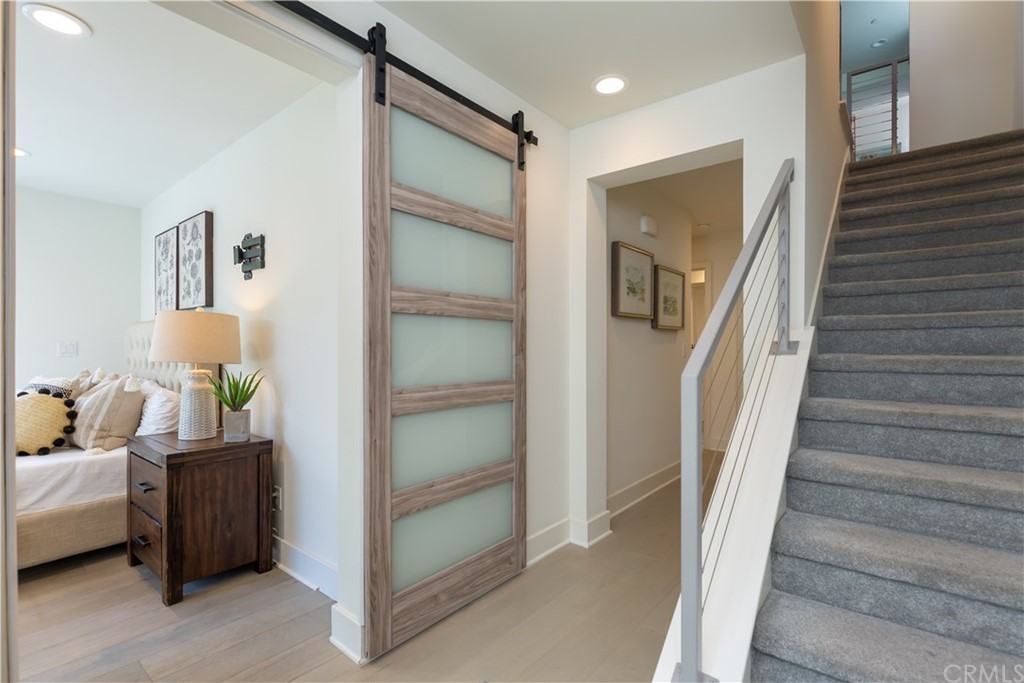5505 River Avenue Newport Beach, CA 92663 - Photo 28 of 40 a view of a bedroom with baby crib and cabinet