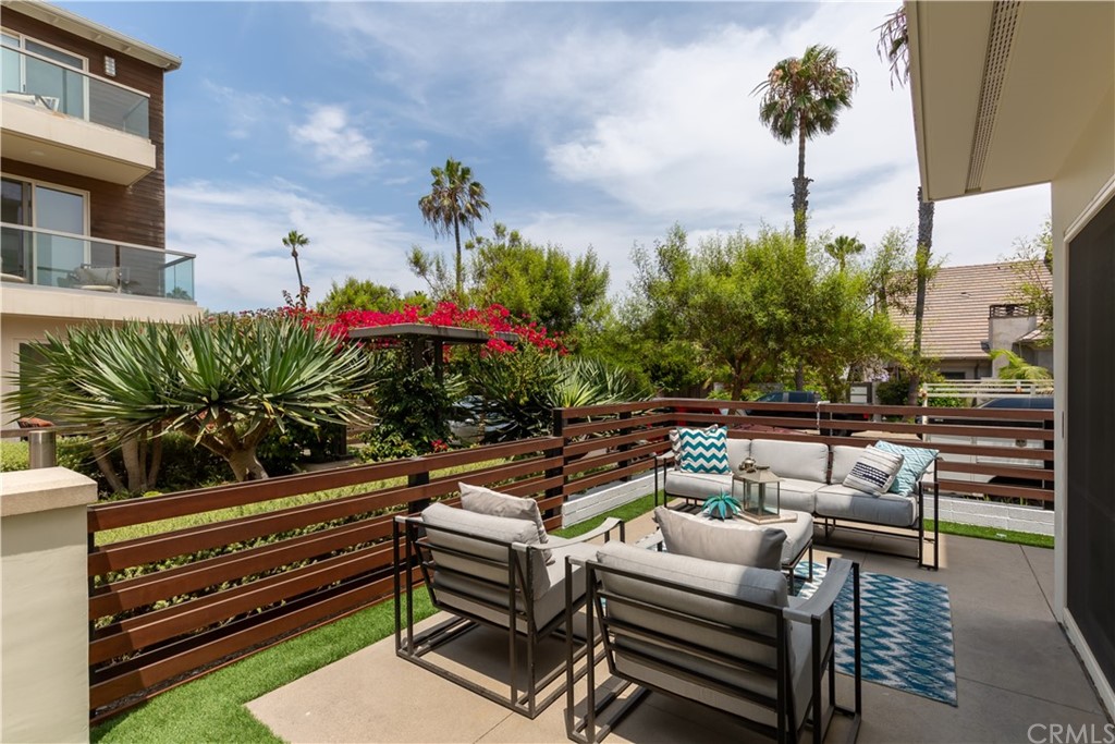 5505 River Avenue Newport Beach, CA 92663 - Photo 30 of 40 a view of a patio with couches and potted plants