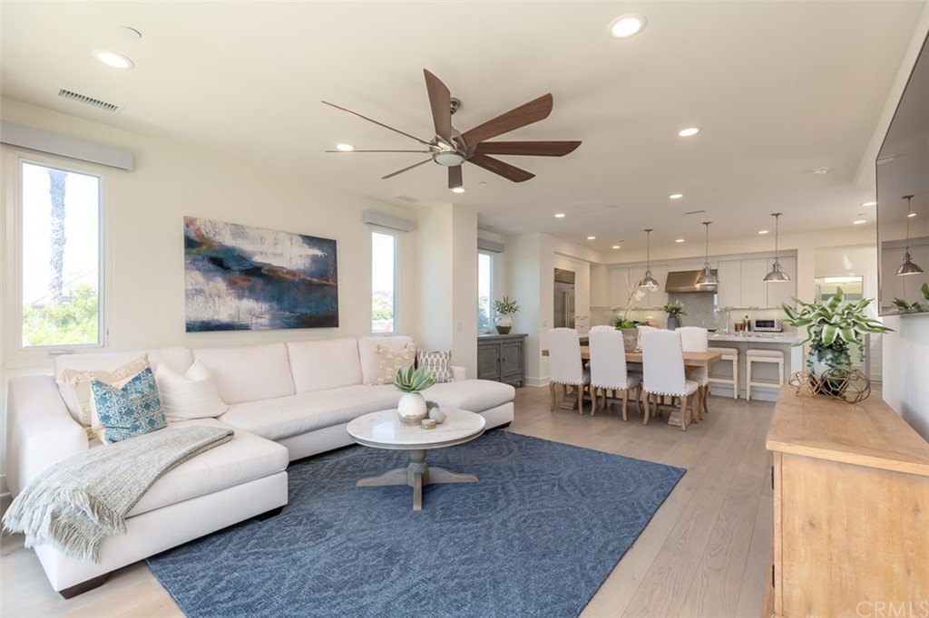 5505 River Avenue Newport Beach, CA 92663 - Photo 4 of 40 a living room with furniture and view of kitchen