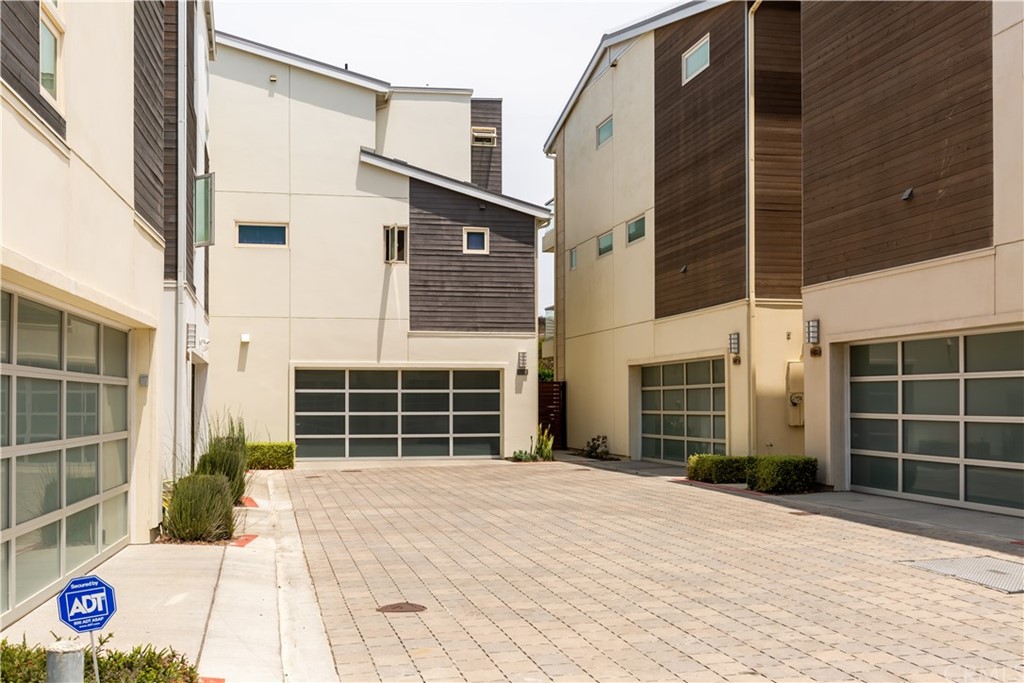 5505 River Avenue Newport Beach, CA 92663 - Photo 35 of 40 a front view of a house with a gate