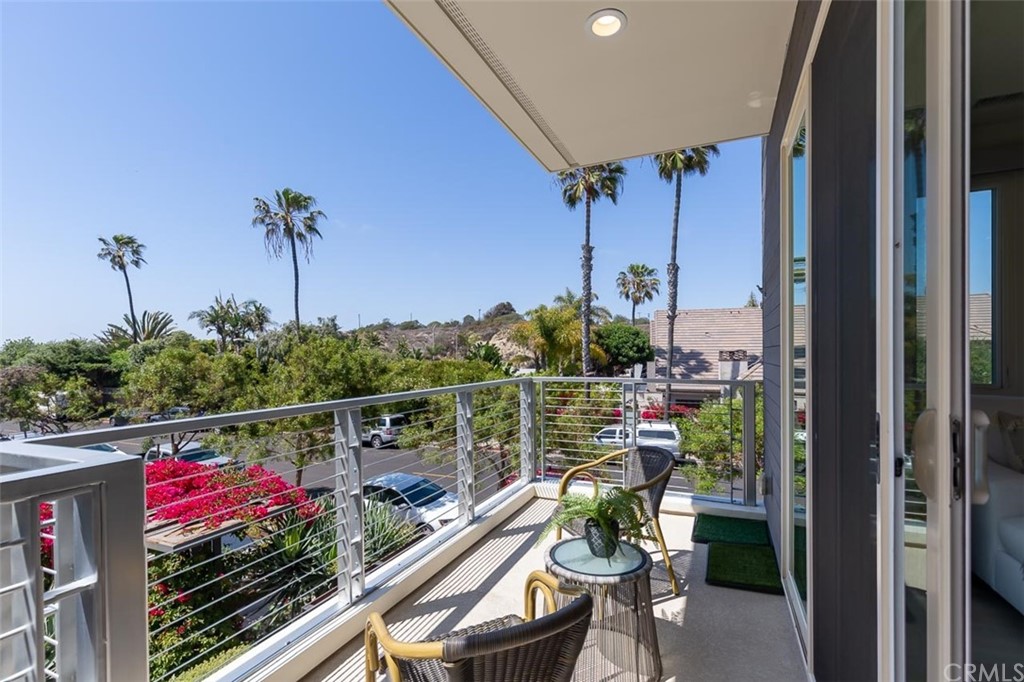 5505 River Avenue Newport Beach, CA 92663 - Photo 8 of 40 a view of a balcony with chairs