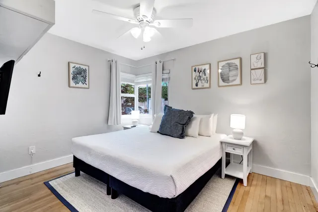 a bedroom with a bed and a table