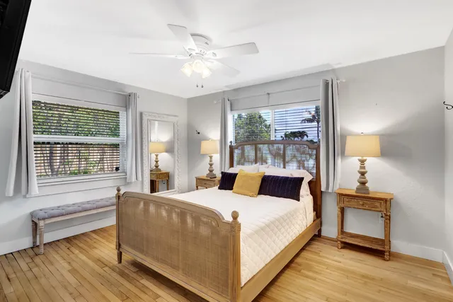 a bedroom with a large bed and a large window