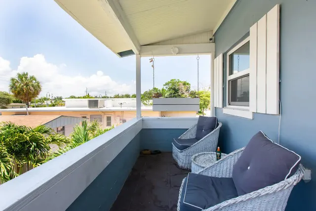 a view of balcony with furniture